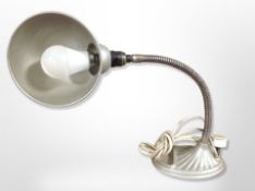 A vintage adjustable table lamp with diecast metal base, height 48cm.