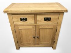 A contemporary oak side cabinet,