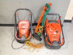 Two Flymo lawn mowers, and two further strimmers.