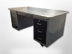 A mid 20th century enamelled metal twin pedestal desk,