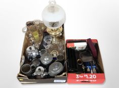 A brass table lamp in the form of an oil lamp with etched glass shade,