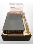 A Tassimo coffee capsule stand in box, plus another chrome metal stand.