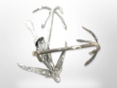 Three galvanised metal anchors, largest 52cm long.