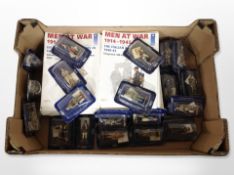 A group of Delprado diecast military figures and related magazines.