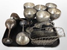 A set of nine EPNS goblets and a plated basket.