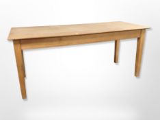 A pine farmhouse style dining table,