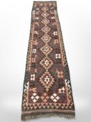An eastern flat weave runner,