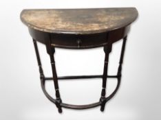 An oak demi-lune hall table,