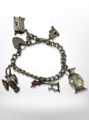 A silver charm bracelet CONDITION REPORT: 40.