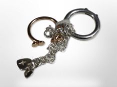 Two unusual silver rings and a silver bracelet.