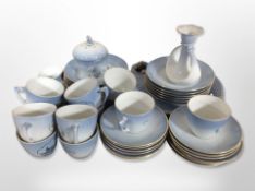 Approximately 40 pieces of Bing and Grøndahl tea china, plus a candlestick.