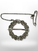 A diamond circular garland brooch, diameter 19mm CONDITION REPORT: 3.