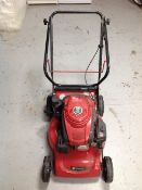 An Einhell petrol lawn mower.