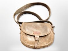 An antique stitched leather cartridge bag,
