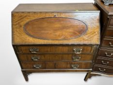 An Edwardian mahogany bureau in George III style,