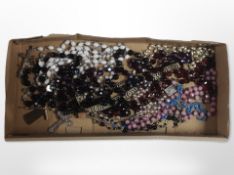 A tray of mixed prayer beads, crosses and crucifixes, etc.