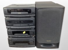 A Technics four-piece Hi-Fi system and a pair of speakers.