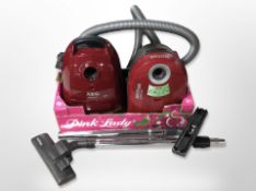 A Nilfisk vacuum cleaner, and an AEG vacuum.