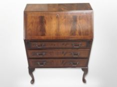A reproduction inlaid mahogany bureau, 75cm wide x 43cm deep x 100cm high.