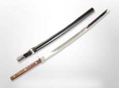 A reproduction katana in sheath, blade 68