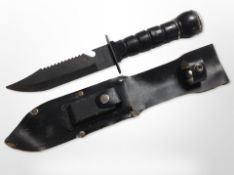 A dagger in sheath with blade stamped 'Taiwan'.