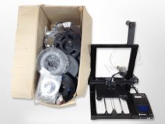 A Mega Zero 3D printer, boxed containing assorted reels of plastic cable.