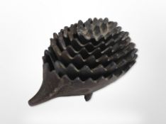 A set of six nesting bronzed hedgehog ashtrays, largest 11cm long.