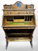 An Edwardian lady's oak roll-top bureau, 79cm wide x 46cm deep x 117cm high.