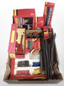 A collection of Hornby 00 gauge carriages and other tenders, model railway buildings, track, etc.