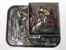 A group of play-worn diecast metal and plastic figurines including soldiers, Native Americans,