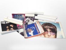 A group of contemporary unframed posters including The Cramps, the Jam, etc.