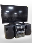 A Logik 32-inch LCD TV with lead and remote, together with a JVC Hi-Fi.