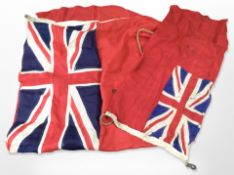 Two antique naval flags, largest 190cm x 90cm.