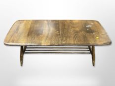 An Ercol stained elm low coffee table, 105cm wide x 46cm deep x 36cm high.
