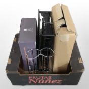 A Tassimo coffee capsule stand in box, plus another chrome metal stand.