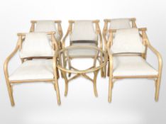 A set of five bamboo armchairs and matching glass-topped occasional table.