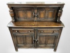An Ercol stained elm buffet sideboard, 123cm wide x 46cm deep x 123cm high.