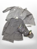 A group of policeman's hats and uniforms.