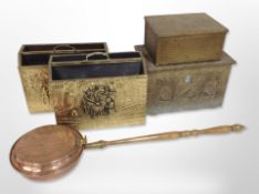 Two embossed brass magazine racks, two further boxes, and a copper bed-warming pan.