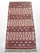 An eastern kilim runner on polychrome ground,