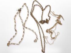 A group of yellow metal chains,