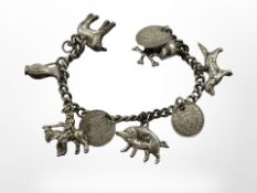 A silver charm bracelet. CONDITION REPORT: 40.5g.
