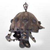 A Mongol-style copper and leather helmet.