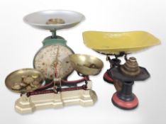 A group of antique enamelled cast-iron scales with weights.