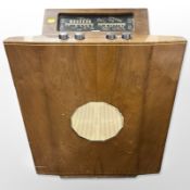 A mid-20th century Murphy walnut-cased radio, width 61cm.