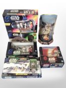 Six Hasbro and other Star Wars figurines, boxed.