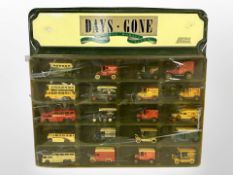 A group of Lledo Days Gone diecast cars in display stand.