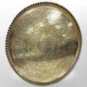 A large decorative brass charger, diameter 65cm.