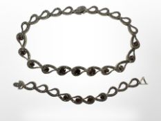 A Sterling silver marcasite and synthetic garnet necklace with matching bracelet,