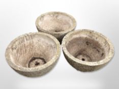 Three concrete garden planters,